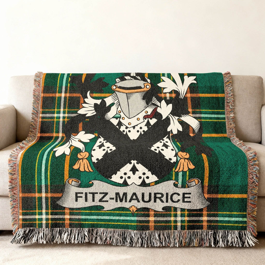 Fitz-Maurice family crest on a green tartan plaid woven throw blanket.