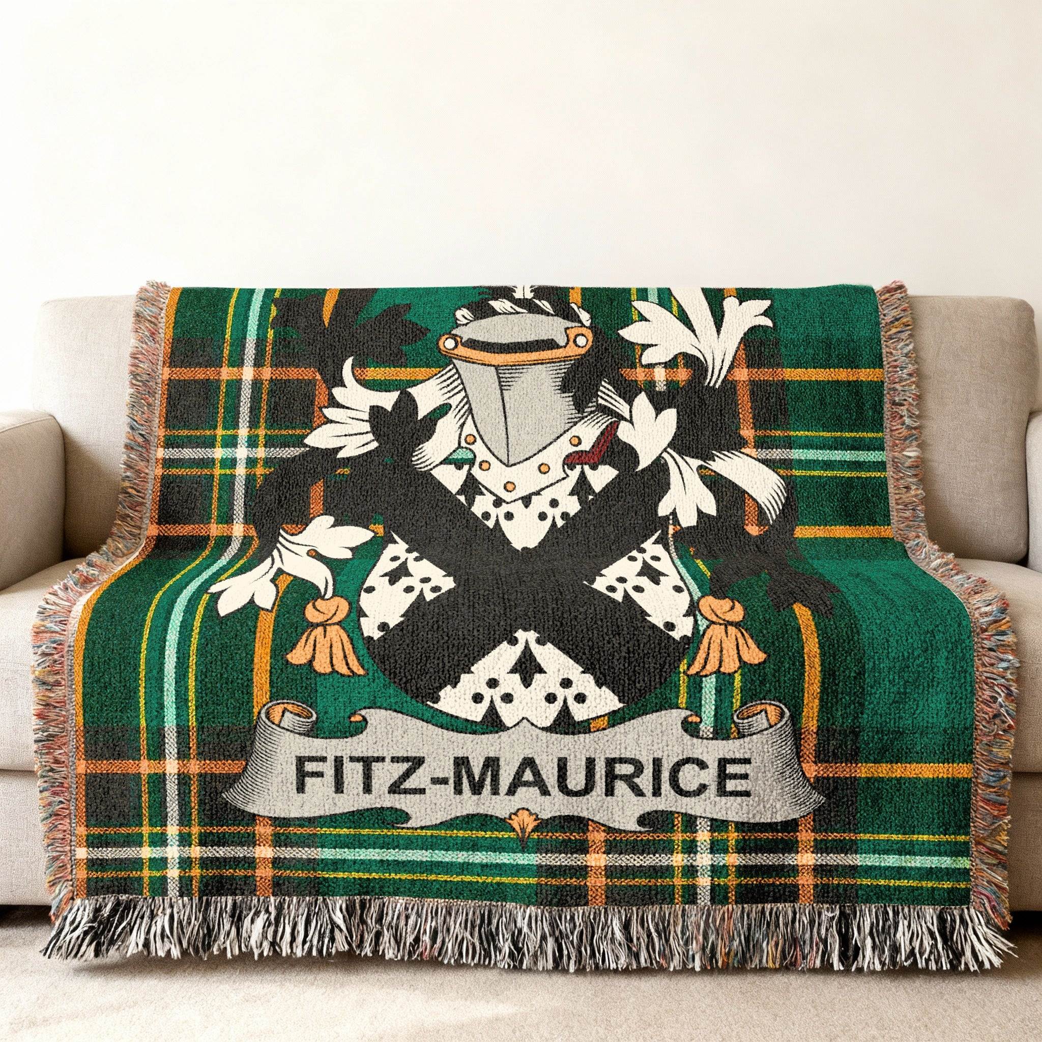 Fitz-Maurice family crest on a green tartan plaid woven throw blanket.