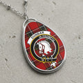 Dunbar clan Scottish tartan necklace with clan crest on tartan background