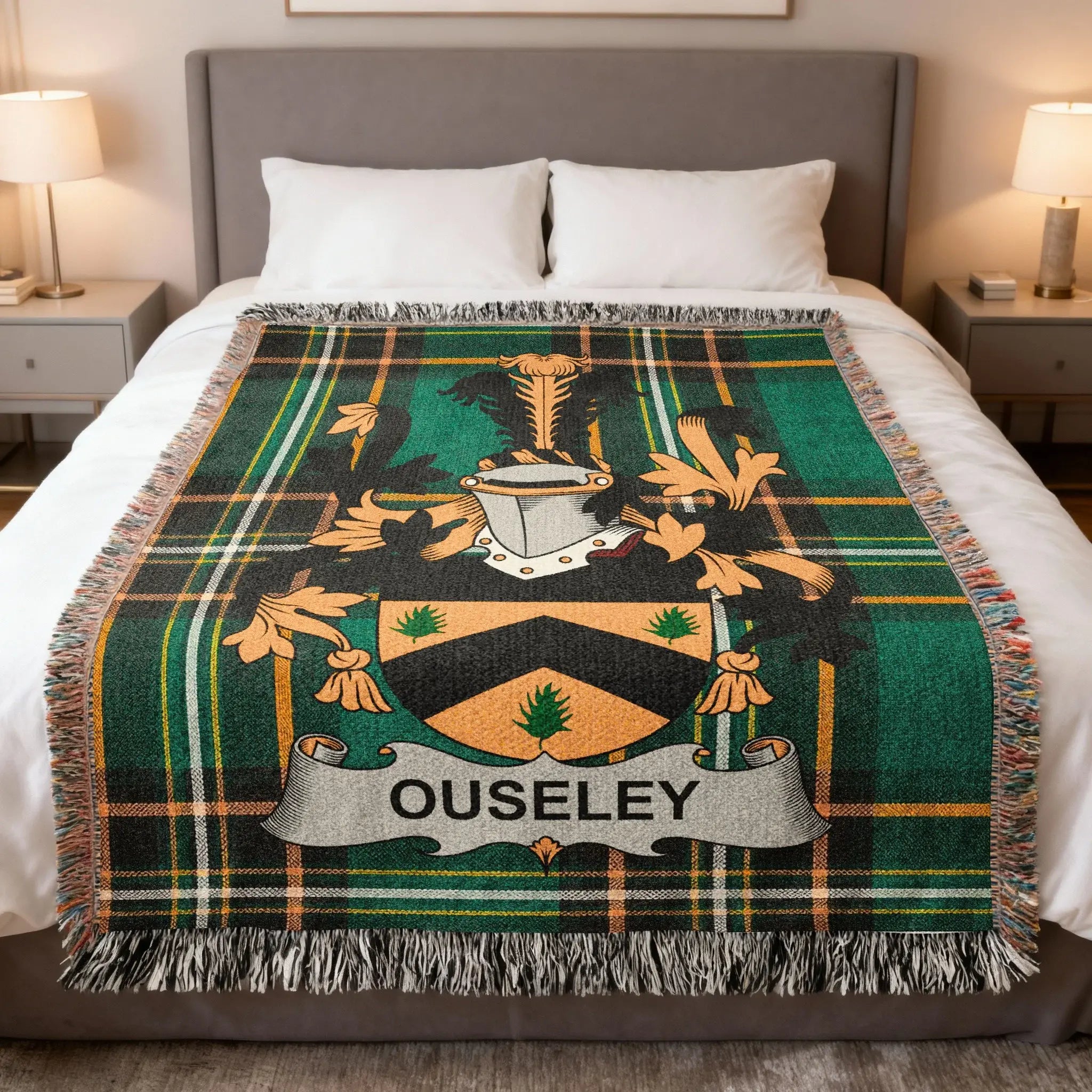 Ouseley tartan blanket featuring a coat of arms and name banner.