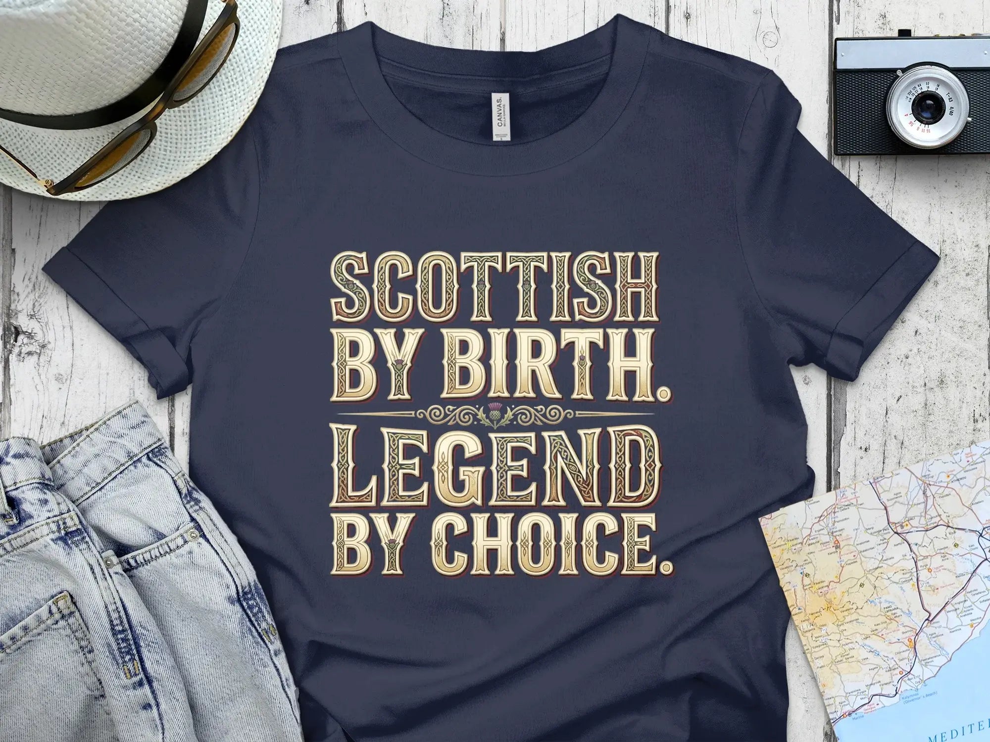 Navy t-shirt with "SCOTTISH BY BIRTH. LEGEND BY CHOICE." text.