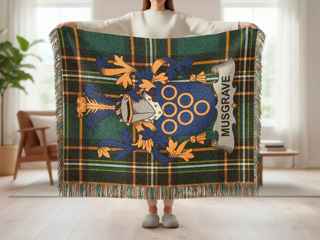 Tartan blanket with the Musgrave family crest and motto.