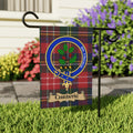 Christie clan tartan garden flag with holly crest — outdoor display