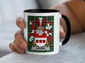 White mug with black rim featuring a family crest with the name "HAUGH".