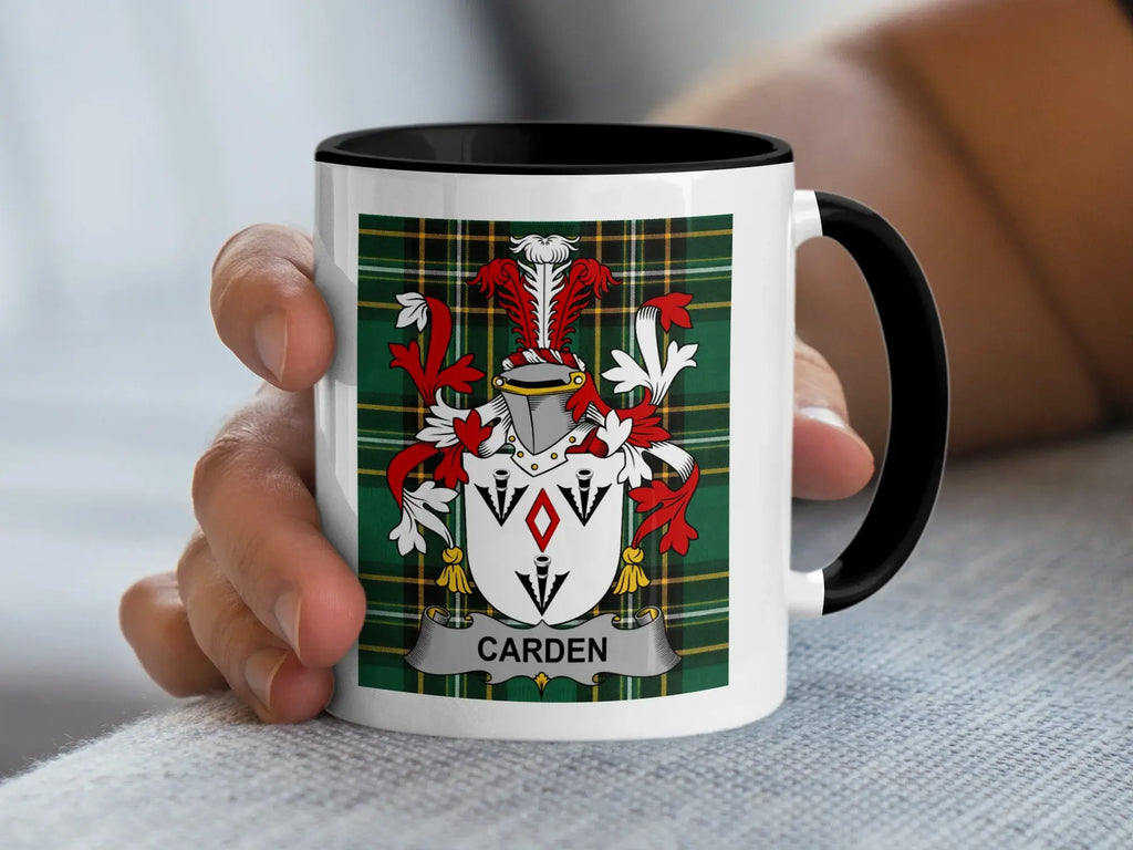 White mug with black rim featuring the "CARDEN" surname coat of arms on a tartan background.