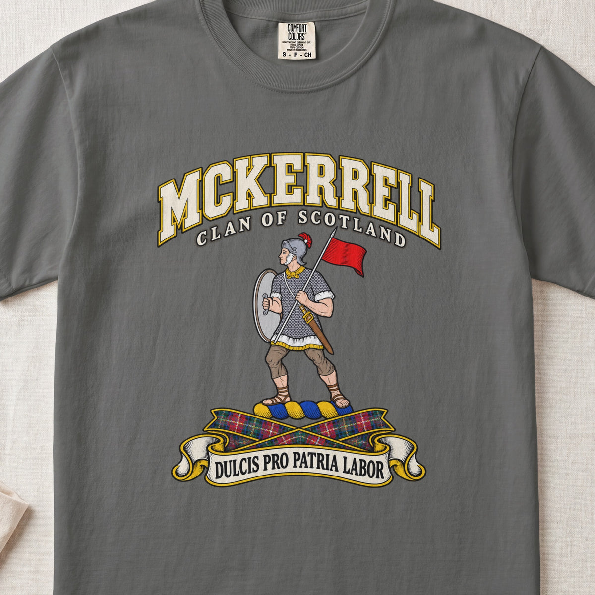 McKerrell Scottish clan T-shirt in Pepper, front view with an armoured figure carrying a shield and red flag and motto banner.