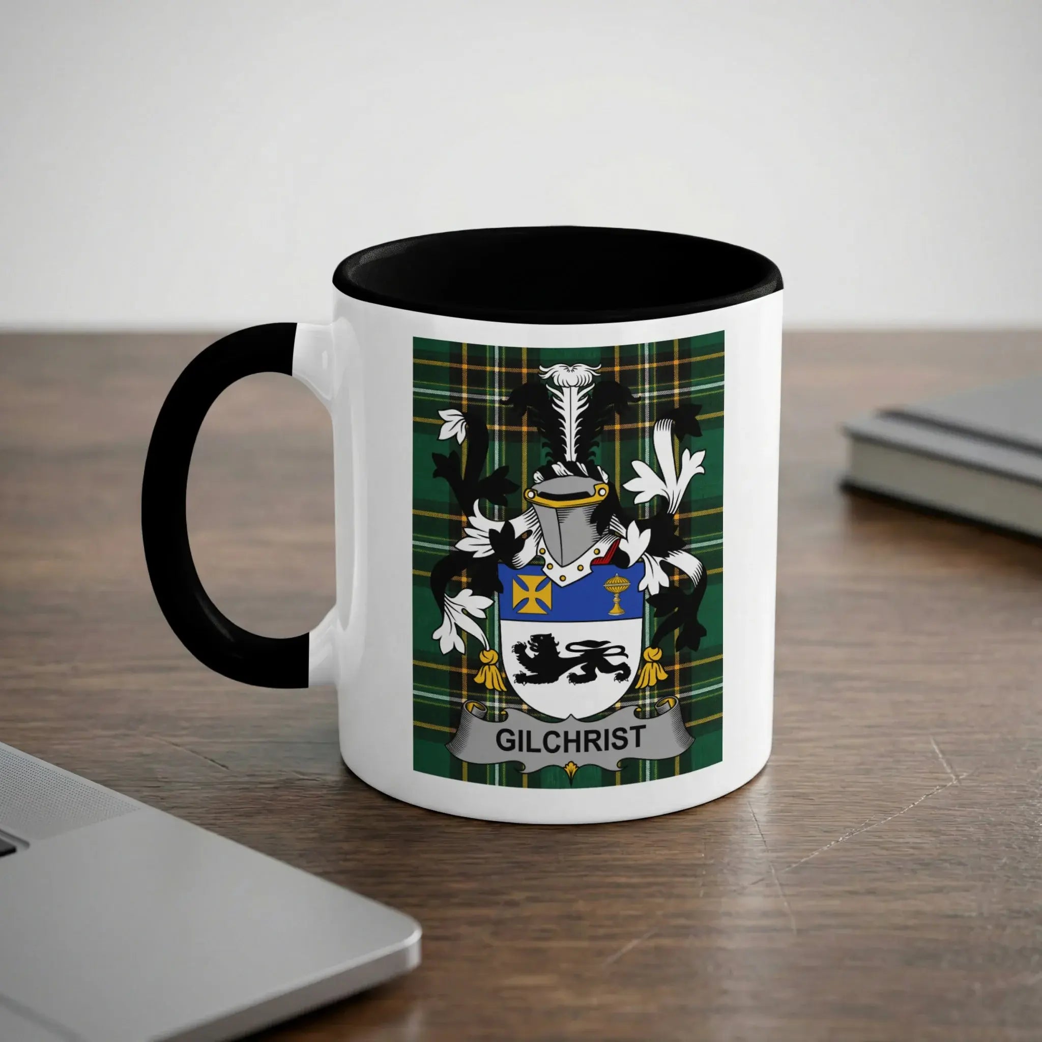 White mug with black handle featuring the Gilchrist family crest.