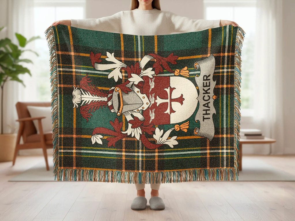 Thacker tartan blanket with coat of arms held by a person.