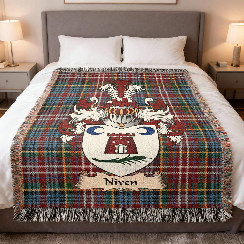 Niven family crest emblem on a Caledonia tartan woven blanket