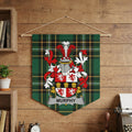 Murphy family crest on a green plaid banner hanging on a wood-paneled wall.