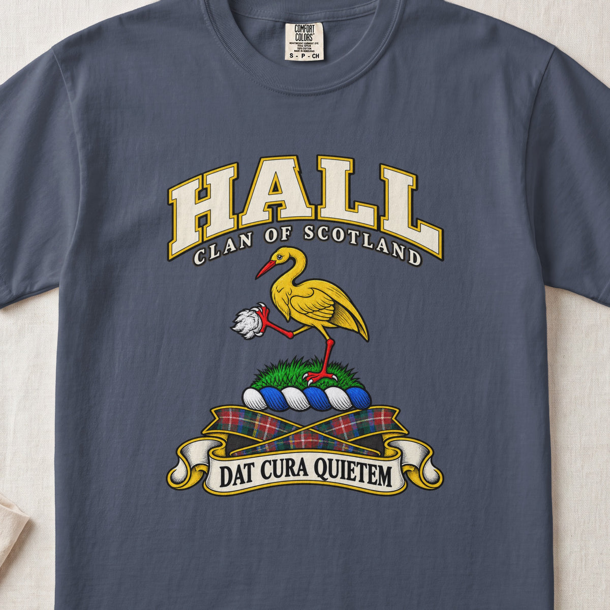 Hall Scottish clan T-shirt in Midnight, front view with a golden crane holding a white stone and motto banner.