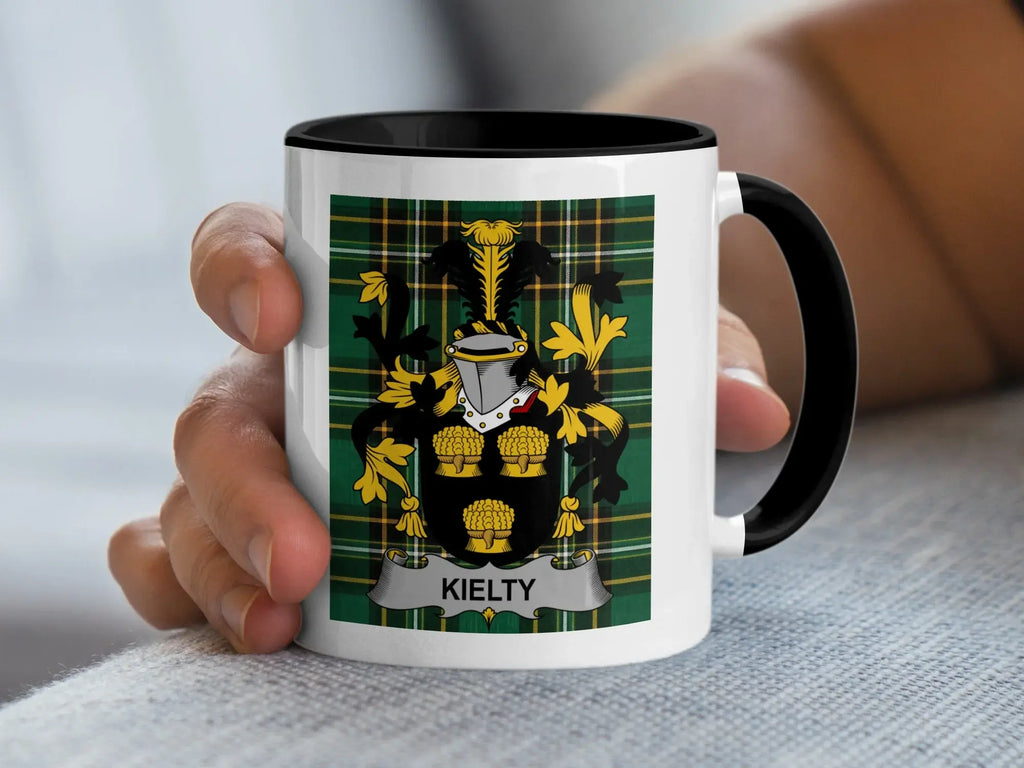 White mug with black rim featuring the coat of arms of the surname Kielty.