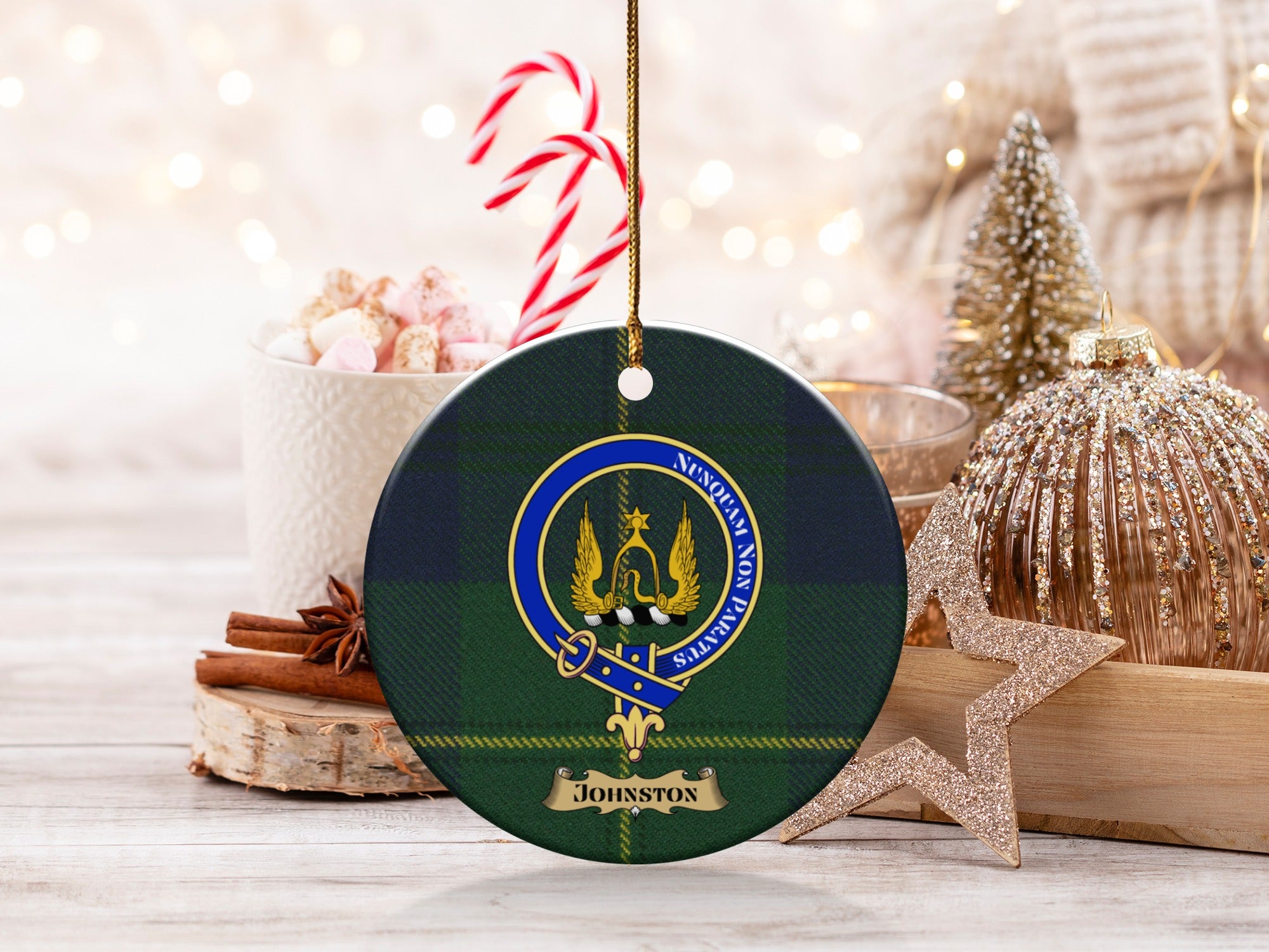 Johnston clan tartan ornament with crest and motto in festive holiday display