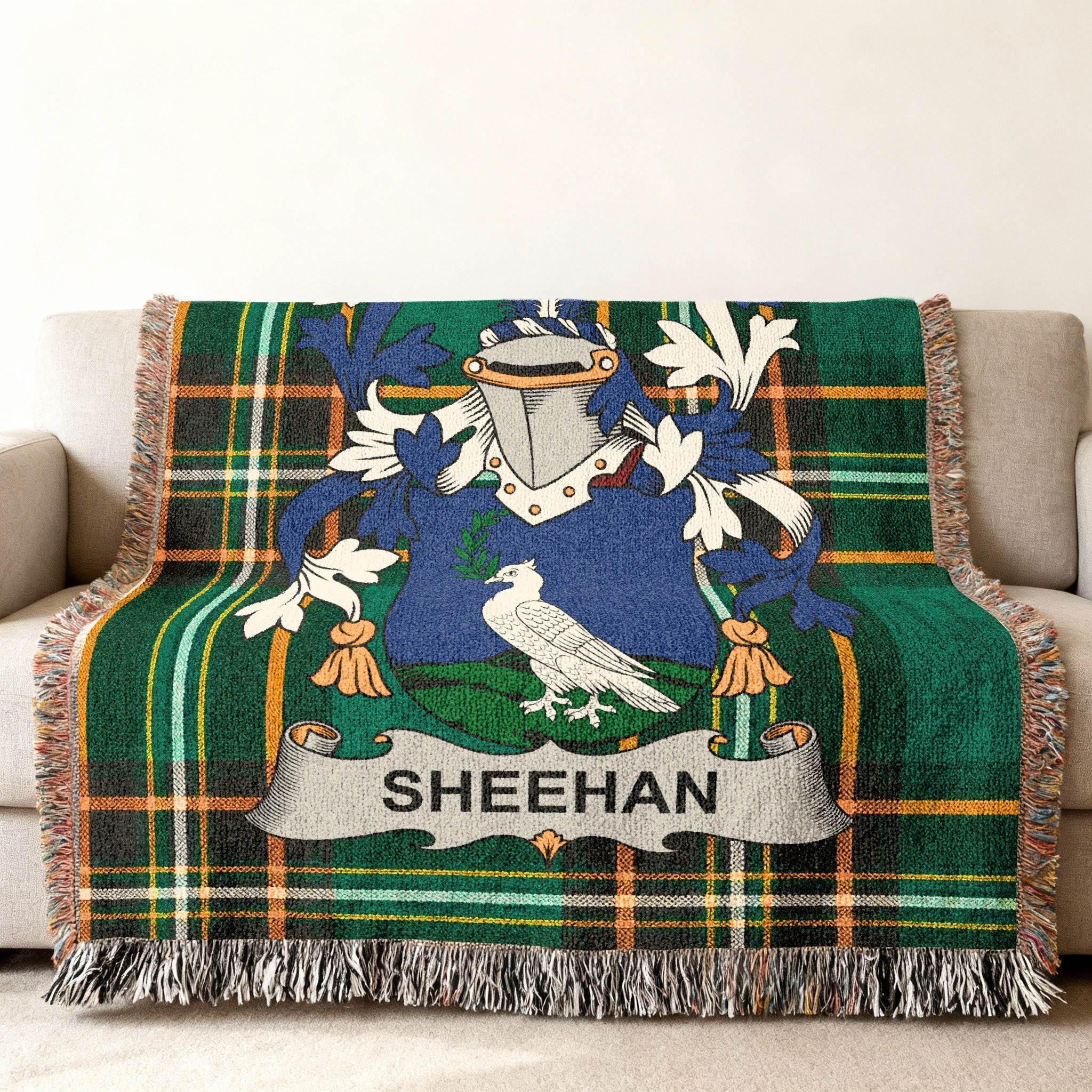 Sheehan family crest on a green tartan throw blanket.