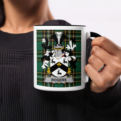 White mug with black rim, featuring a green plaid pattern and the "Rogers" coat of arms.