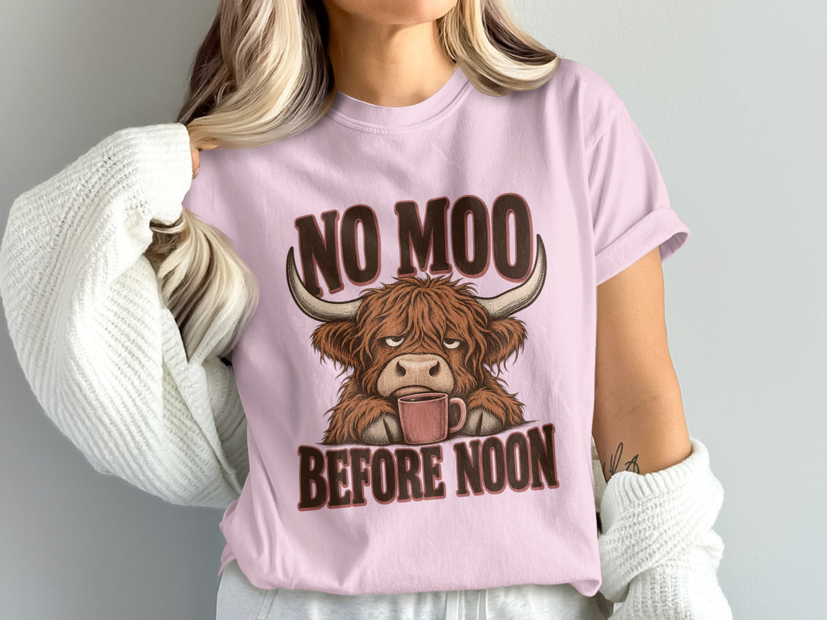 Model wearing the No Moo Before Noon Highland cow Comfort Colors T-shirt in Blossom