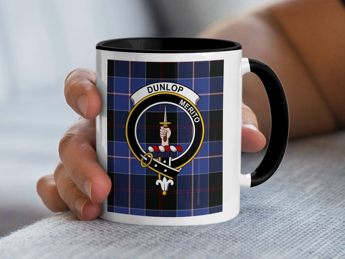 Dunlop Scottish family crest artwork on an 11 oz black accent mug with a tartan background