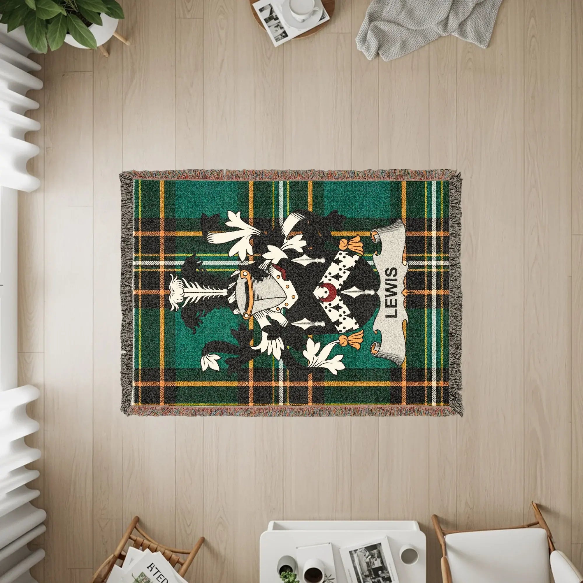 Woven blanket with a green, black, and yellow plaid pattern and the Lewis family crest.