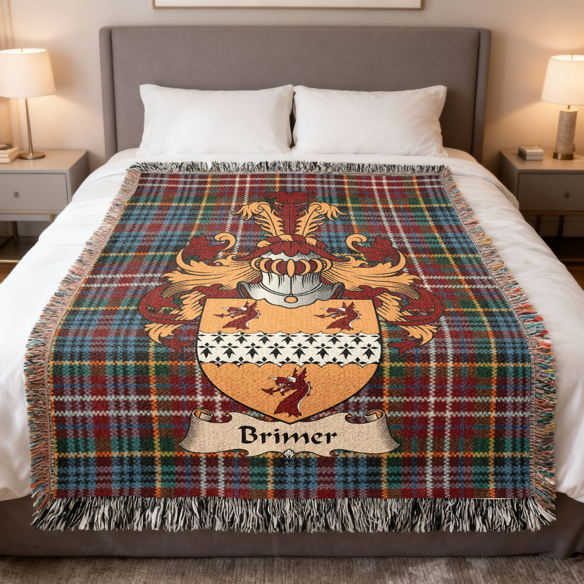Brimer family crest emblem on a Caledonia tartan woven blanket