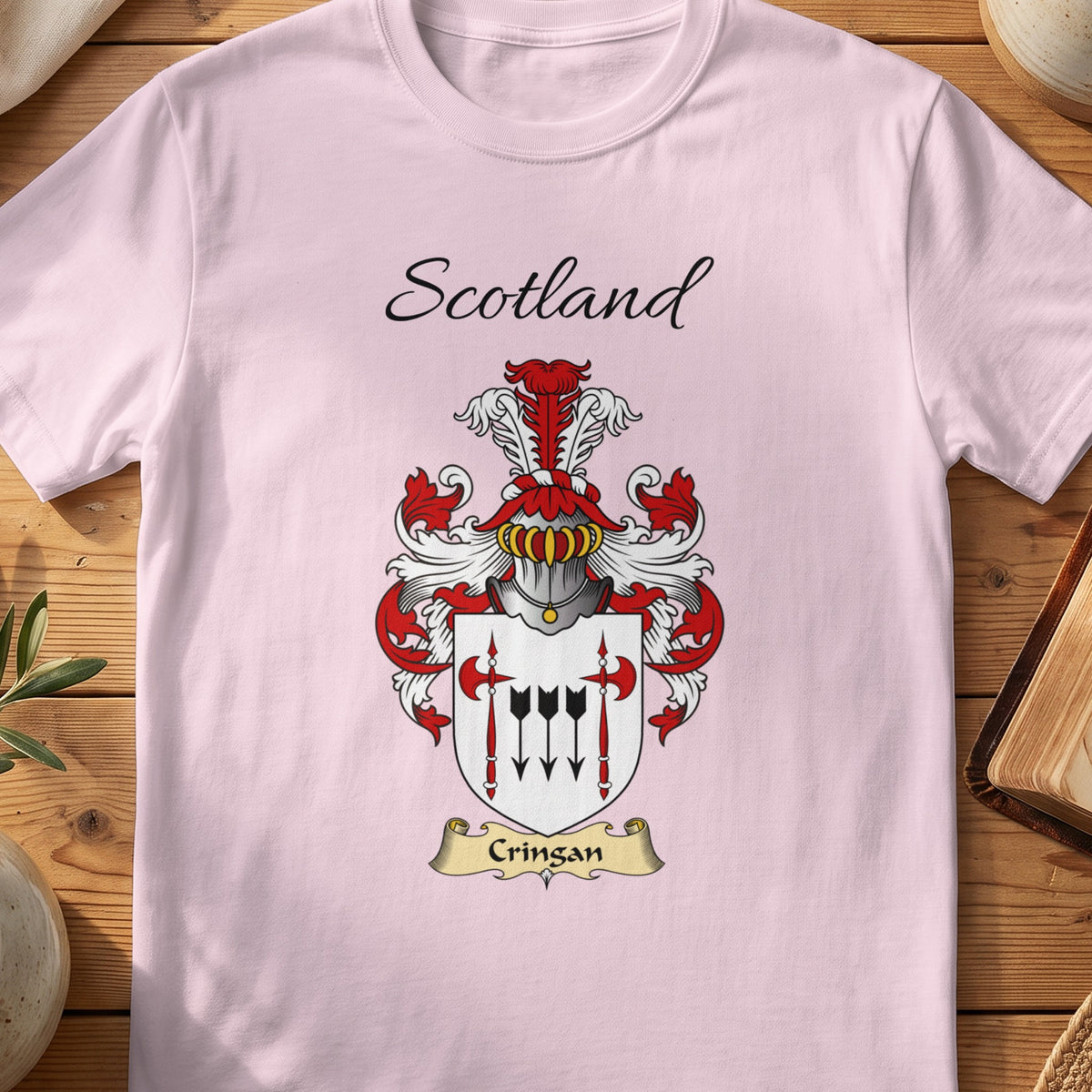 Light Pink Cringan Scottish family shield T-shirt featuring black arrows between red polearms