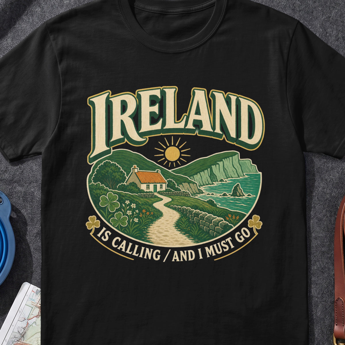 Ireland Is Calling And I Must Go Irish graphic T-shirt in Black, flat-lay mockup
