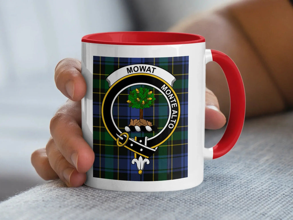 Mug with tartan pattern and "MOWAT MONTE ALTO" crest, held by hand.