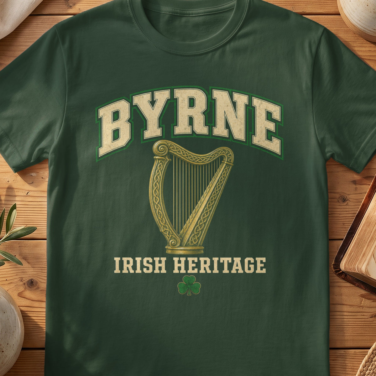 Byrne Irish harp T-shirt in Forest Green, with cream surname lettering, a gold-toned harp, green shamrock and “Irish Heritage” text.