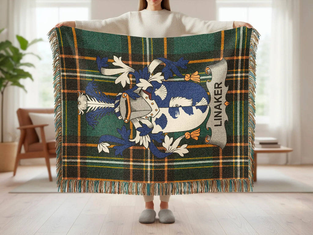 Tartan blanket with Linaker coat of arms and fringed edges.