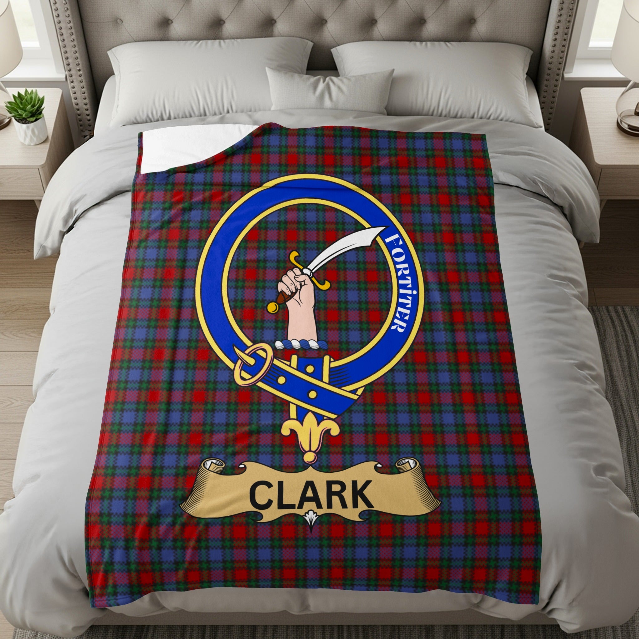 Clark crest with hand holding sword and Fortiter motto on tartan throw
