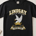 Lindsay Scottish clan T-shirt in Black, front view with a white swan with raised wings and a golden crown and motto banner.