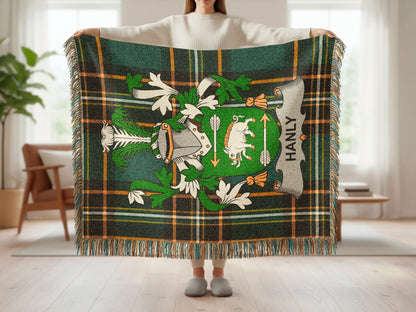 Tartan blanket with crest and "HANLY" text.