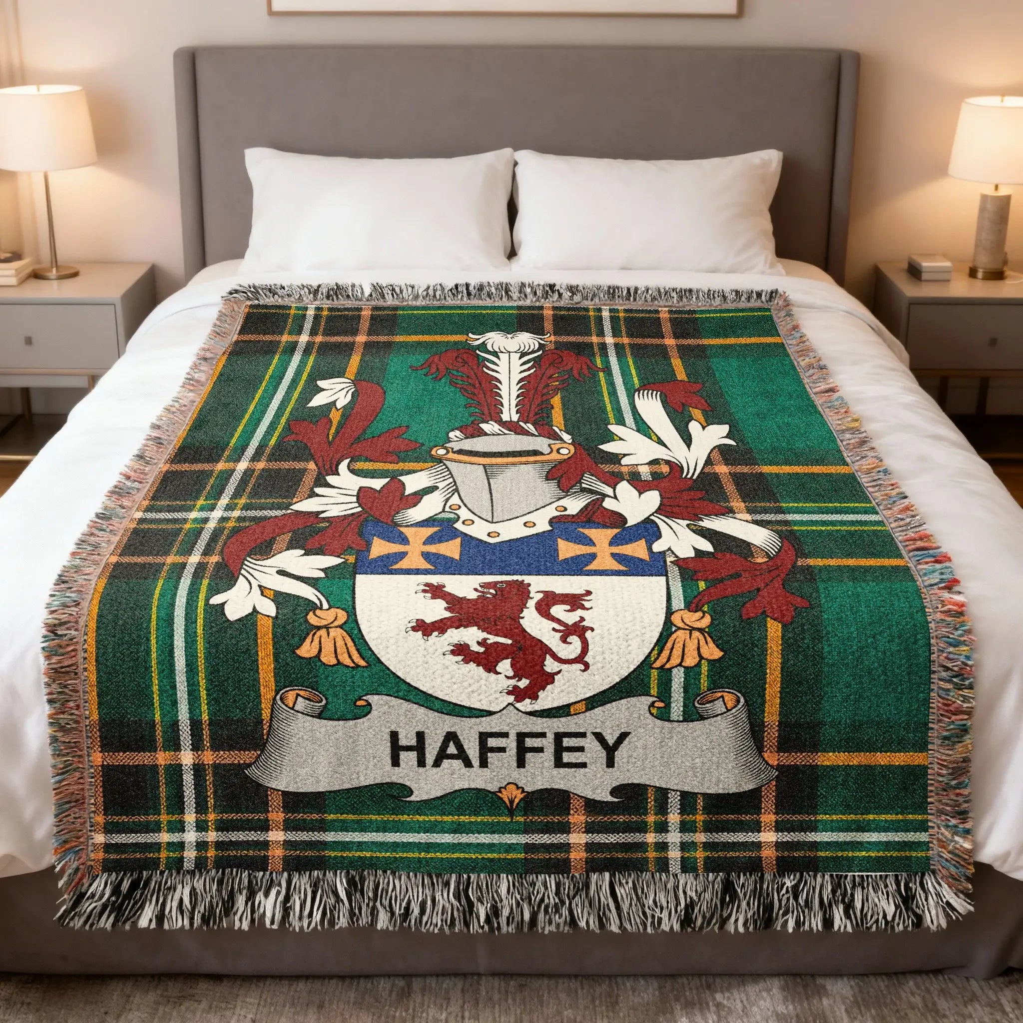 Haffey family crest on a green tartan plaid throw blanket on a bed.