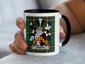 Mug with the Worth family crest on a plaid background.
