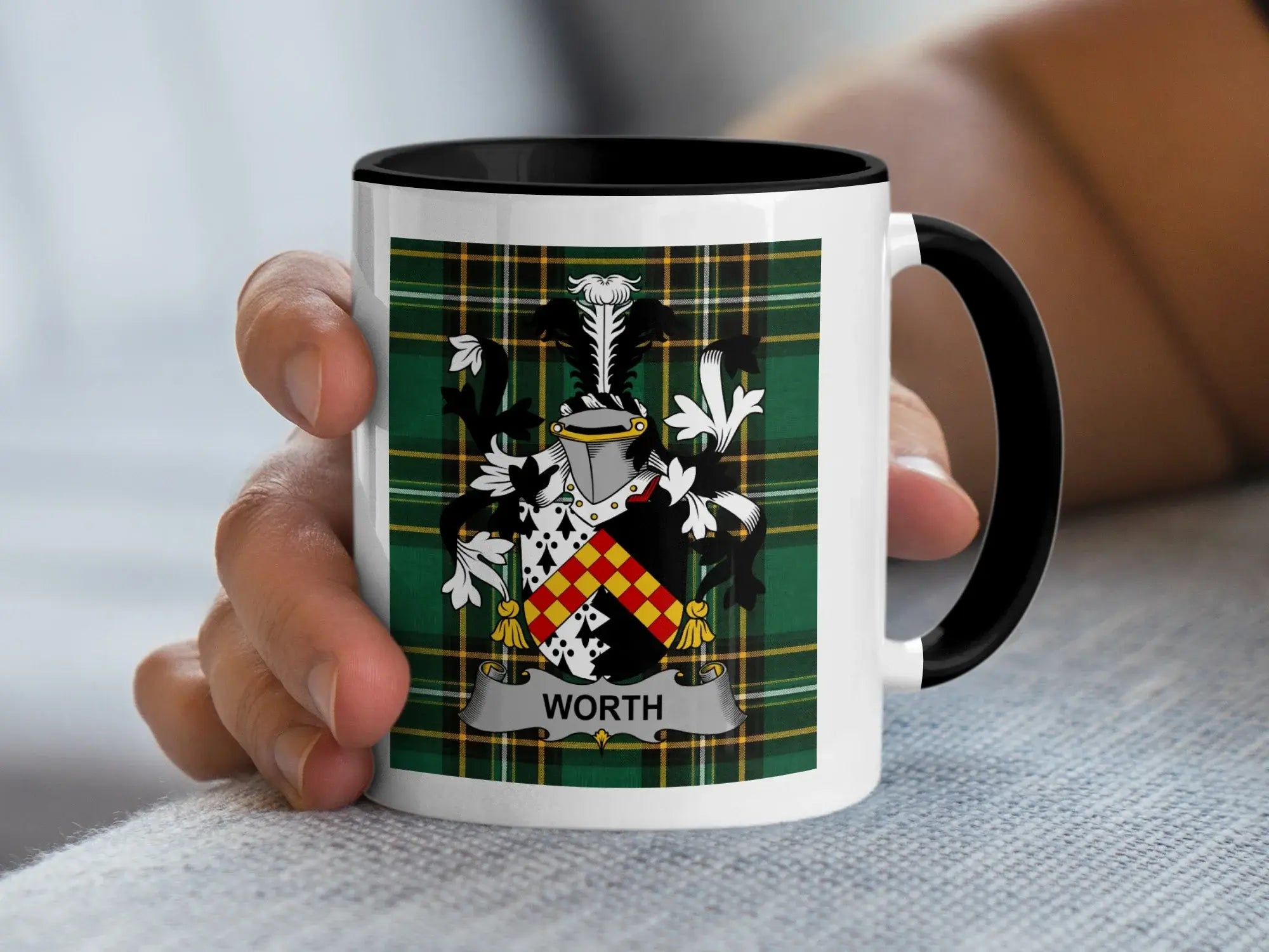 Mug with the Worth family crest on a plaid background.