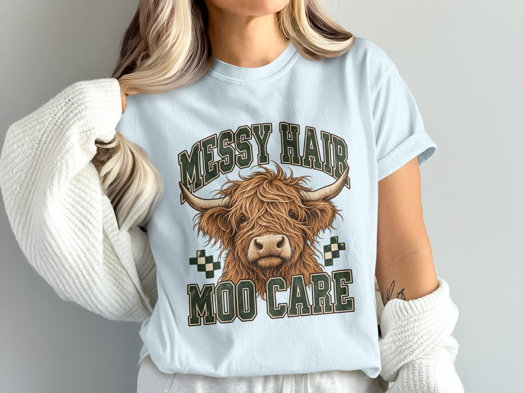 Model wearing the Messy Hair, Moo Care Highland cow Comfort Colors T-shirt in Chambray