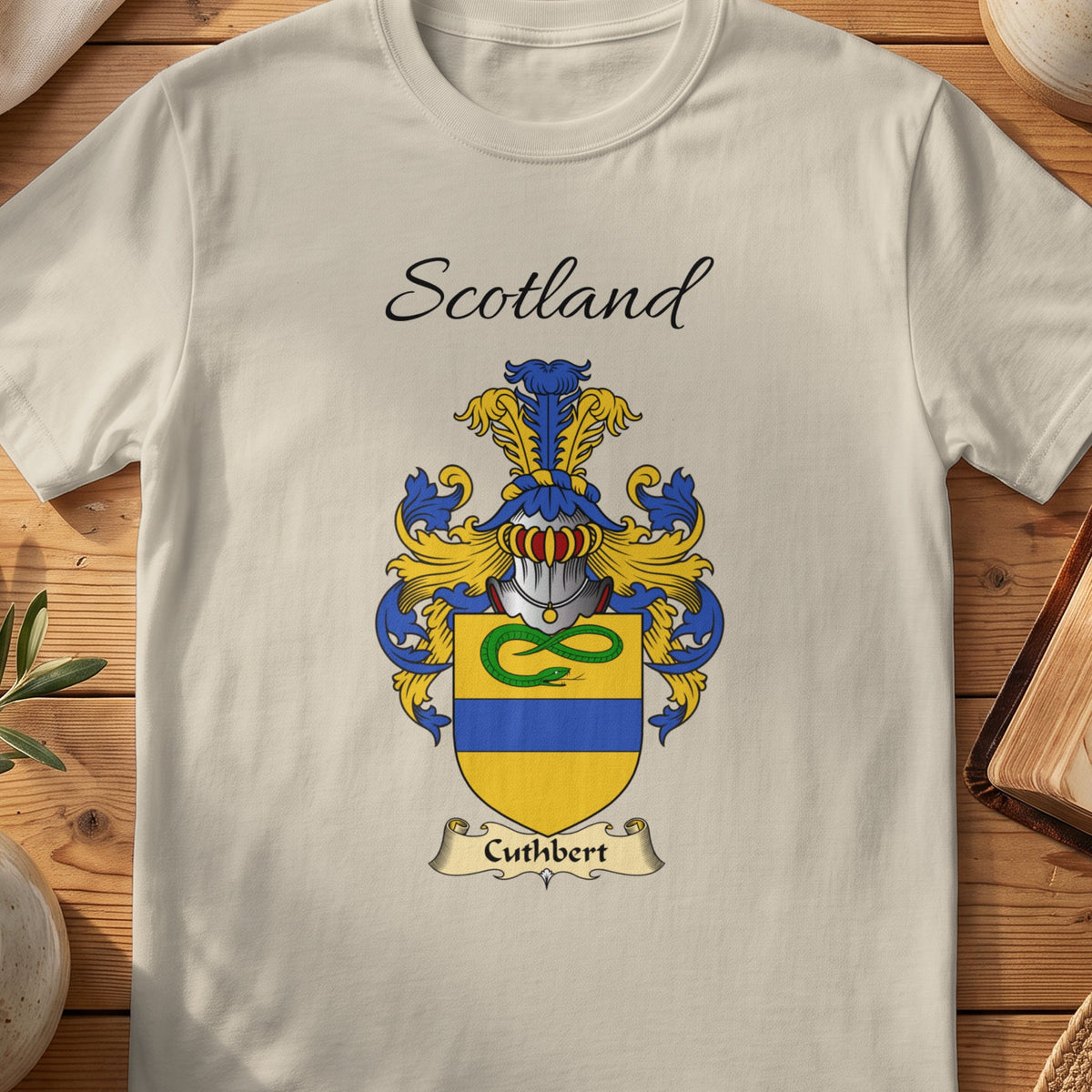 Sand Cuthbert Scottish family shield T-shirt featuring a green intertwined motif above a blue band