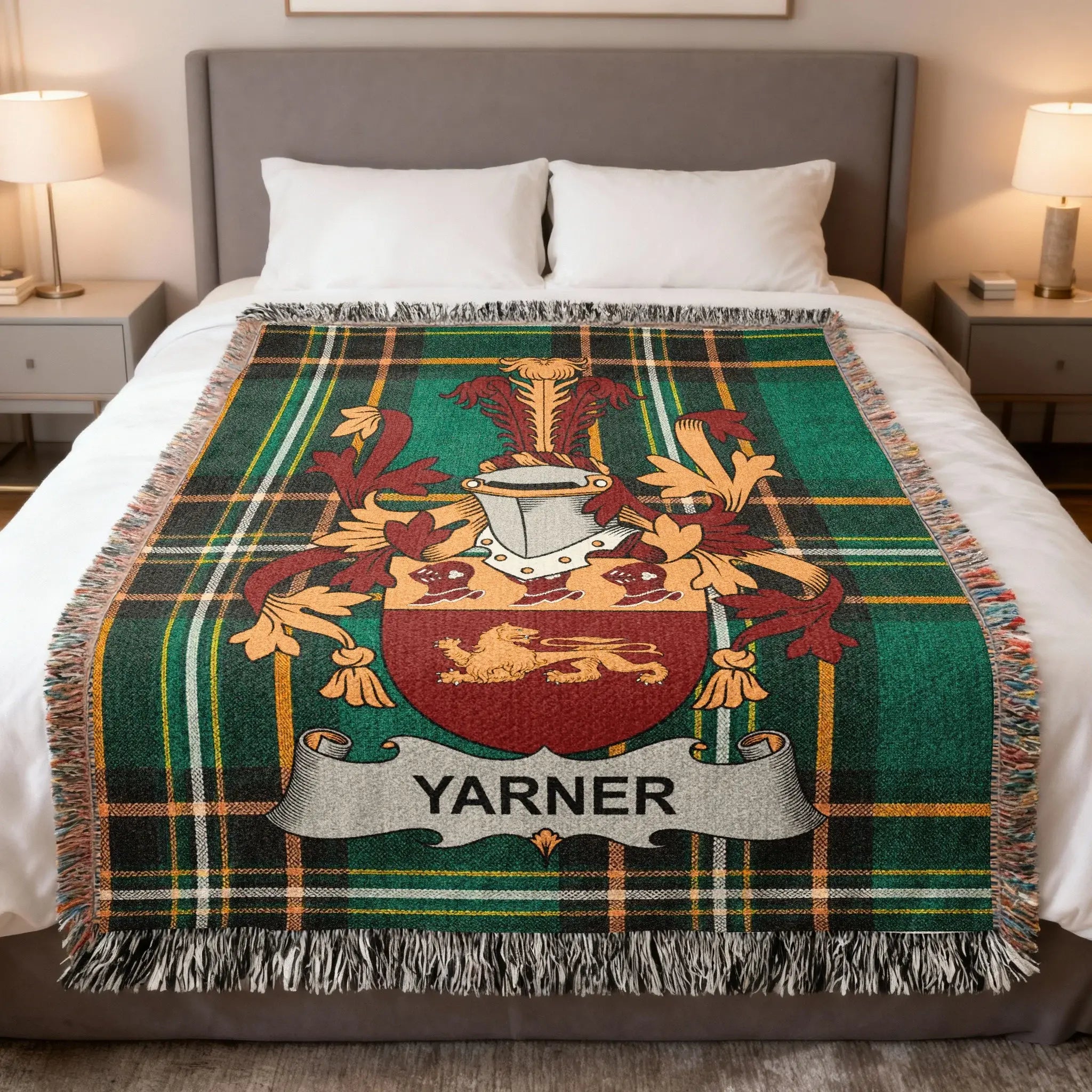 Yarner tartan blanket with coat of arms displayed on a bed.