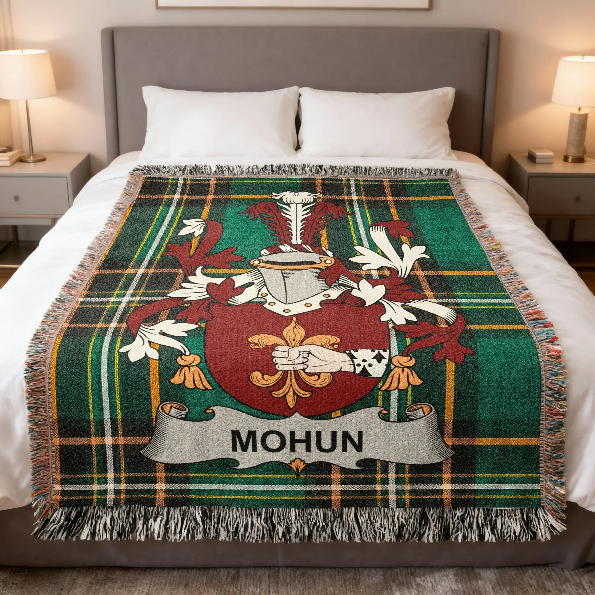 Tartan blanket with Mohun family crest on a bed.