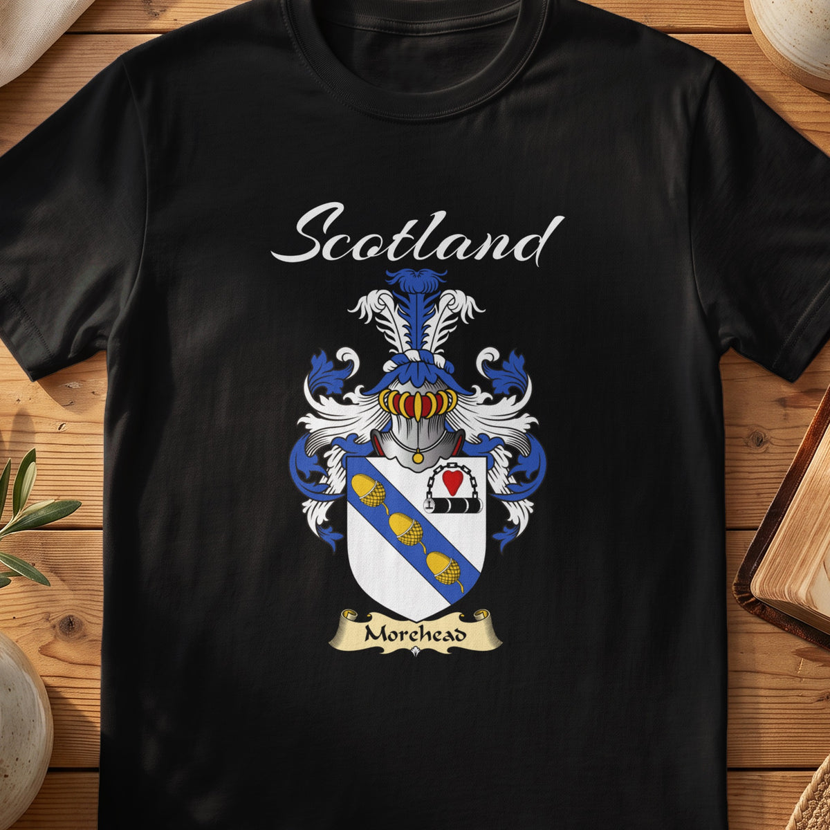Black Morehead Scottish T-shirt featuring a blue diagonal band with gold motifs