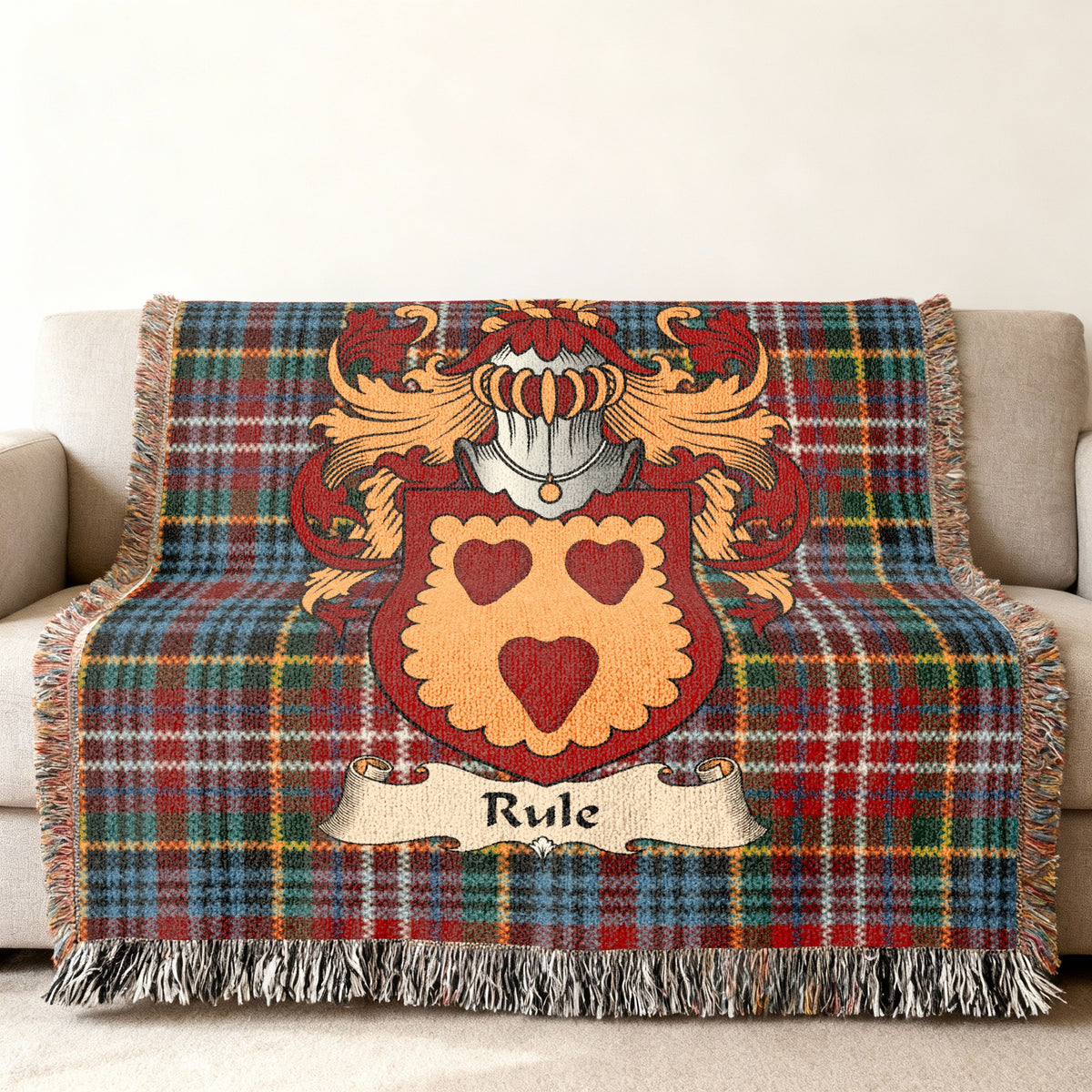 Rule Scottish family shield woven blanket on a Caledonia tartan background