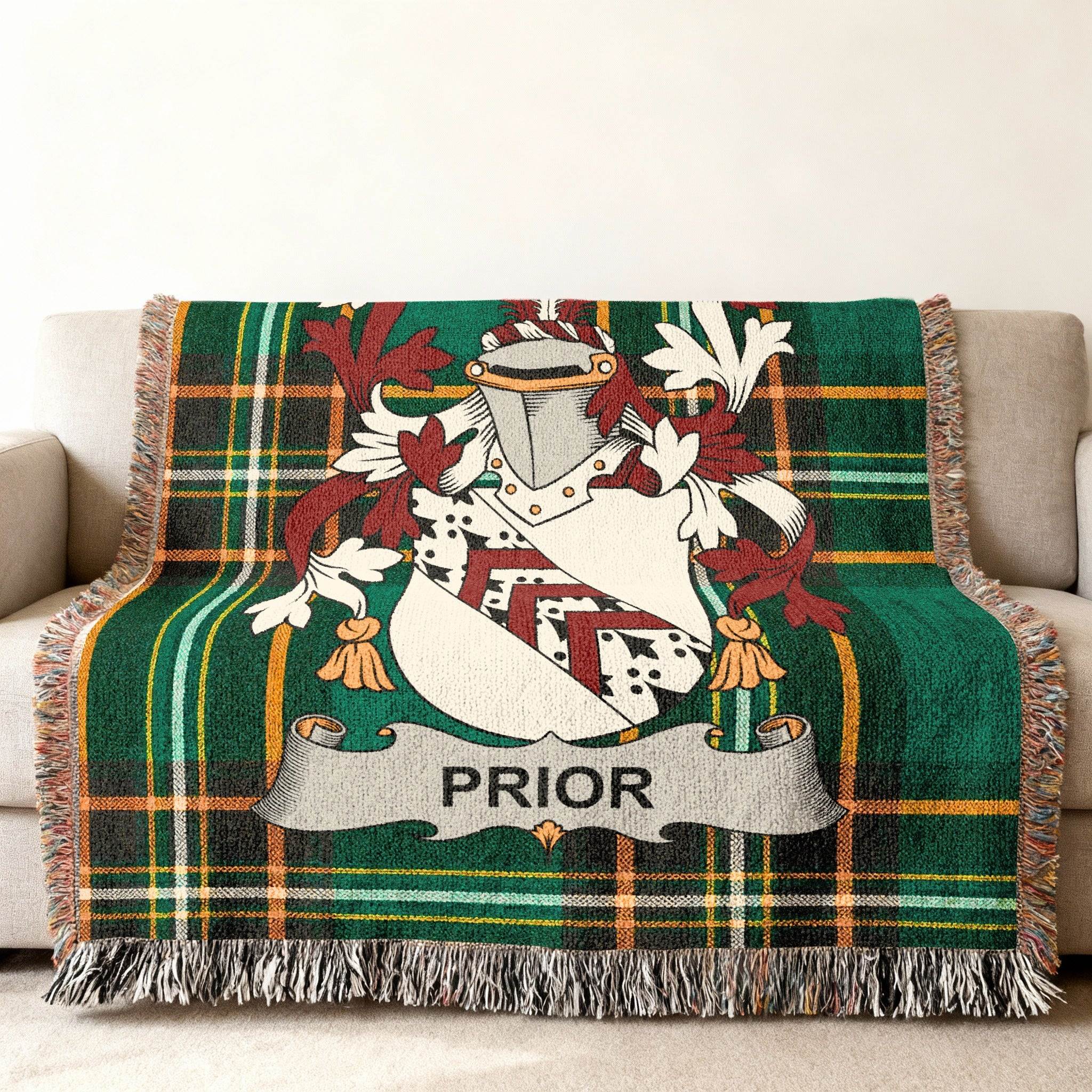 Green plaid throw blanket with the Prior family crest.