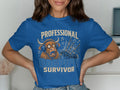 Blue t-shirt with "Professional Bagpipe Survivor" text and a cartoon bagpiper.