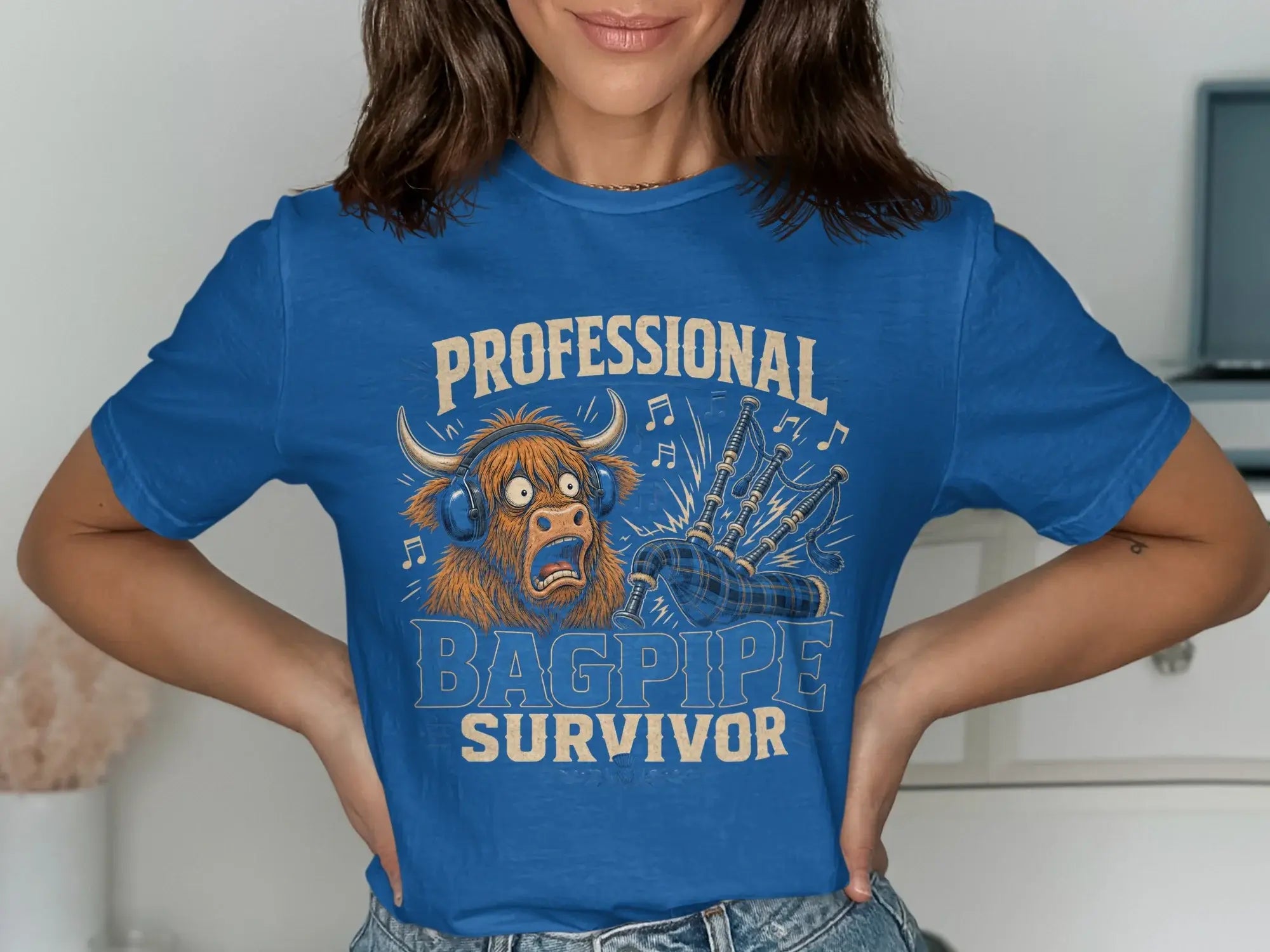Blue t-shirt with "Professional Bagpipe Survivor" text and a cartoon bagpiper.