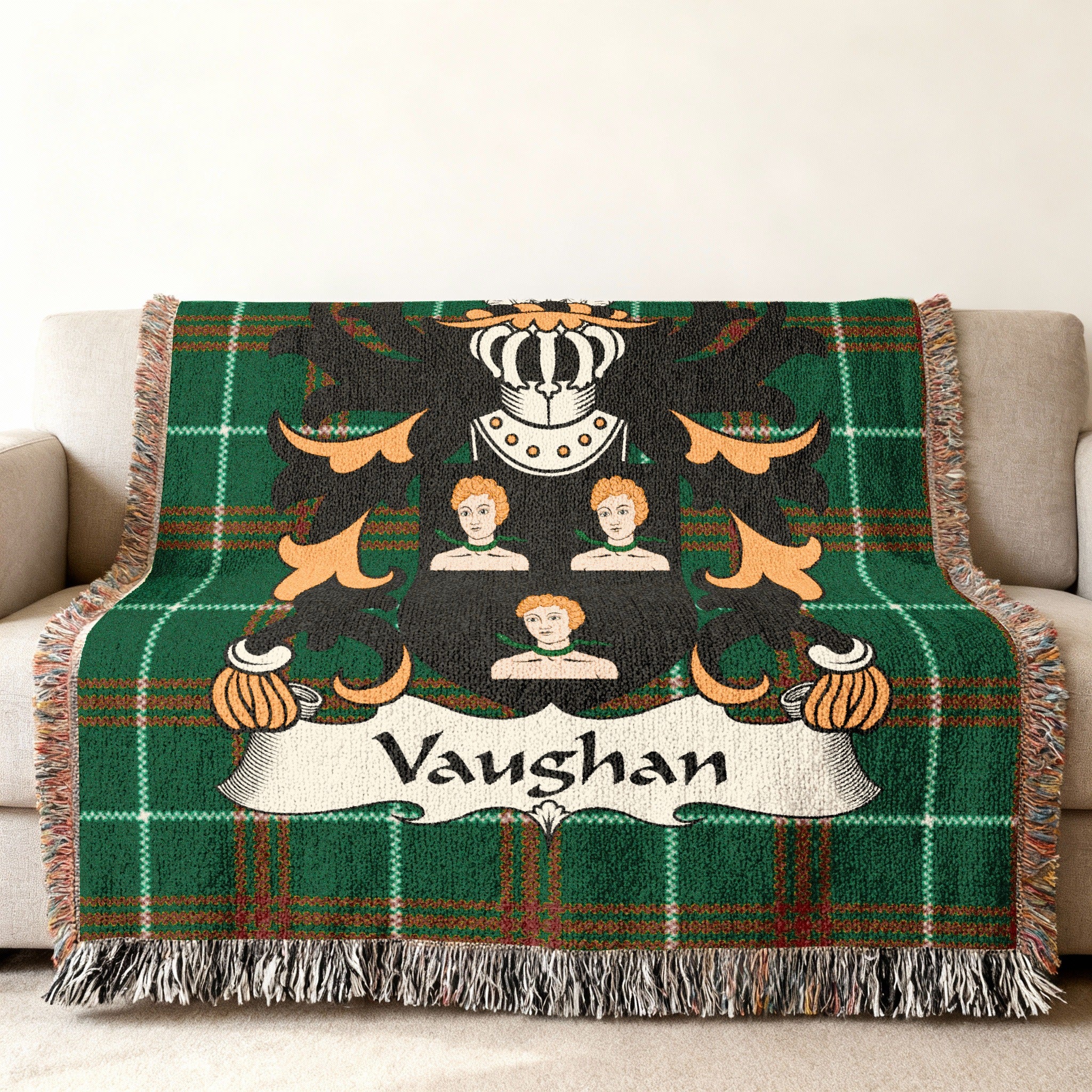 Vaughan family crest on a green plaid woven blanket with fringe.