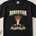 Robertson graphic T-shirt in Black, front flat lay showing varsity lettering and hand and forearm holding a red and gold crown.