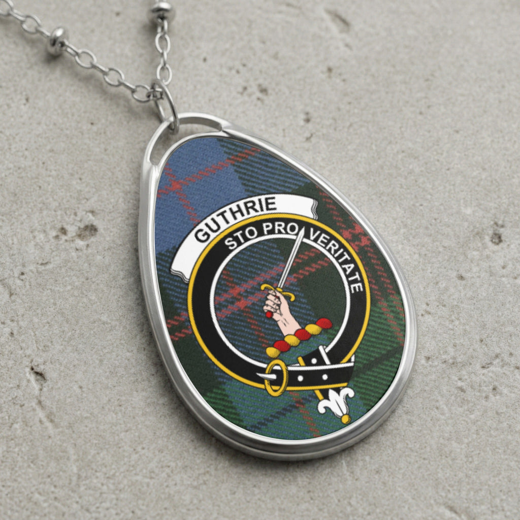 Guthrie clan Scottish tartan necklace with clan crest and Sto Pro Veritate motto on tartan background