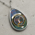 Guthrie clan Scottish tartan necklace with clan crest and Sto Pro Veritate motto on tartan background