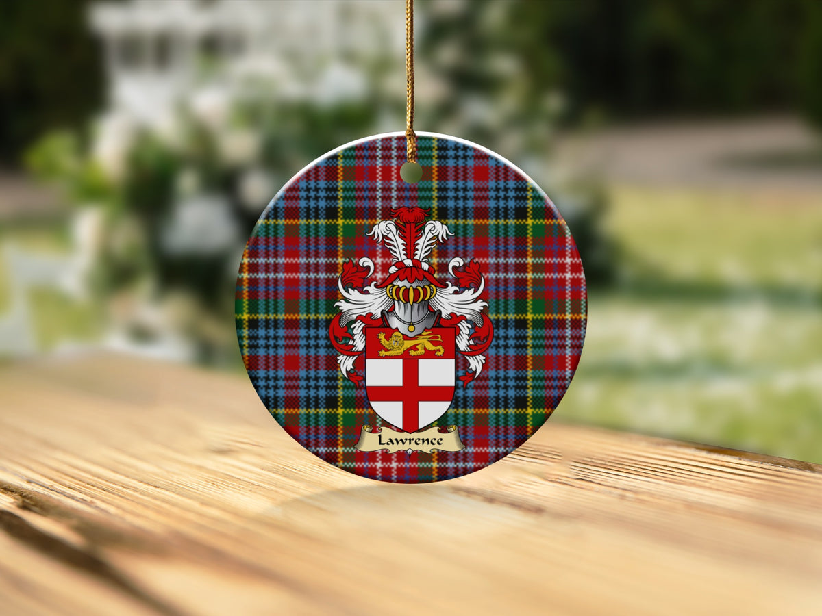 Round Lawrence Scottish clan ornament with family crest on a Caledonia tartan background