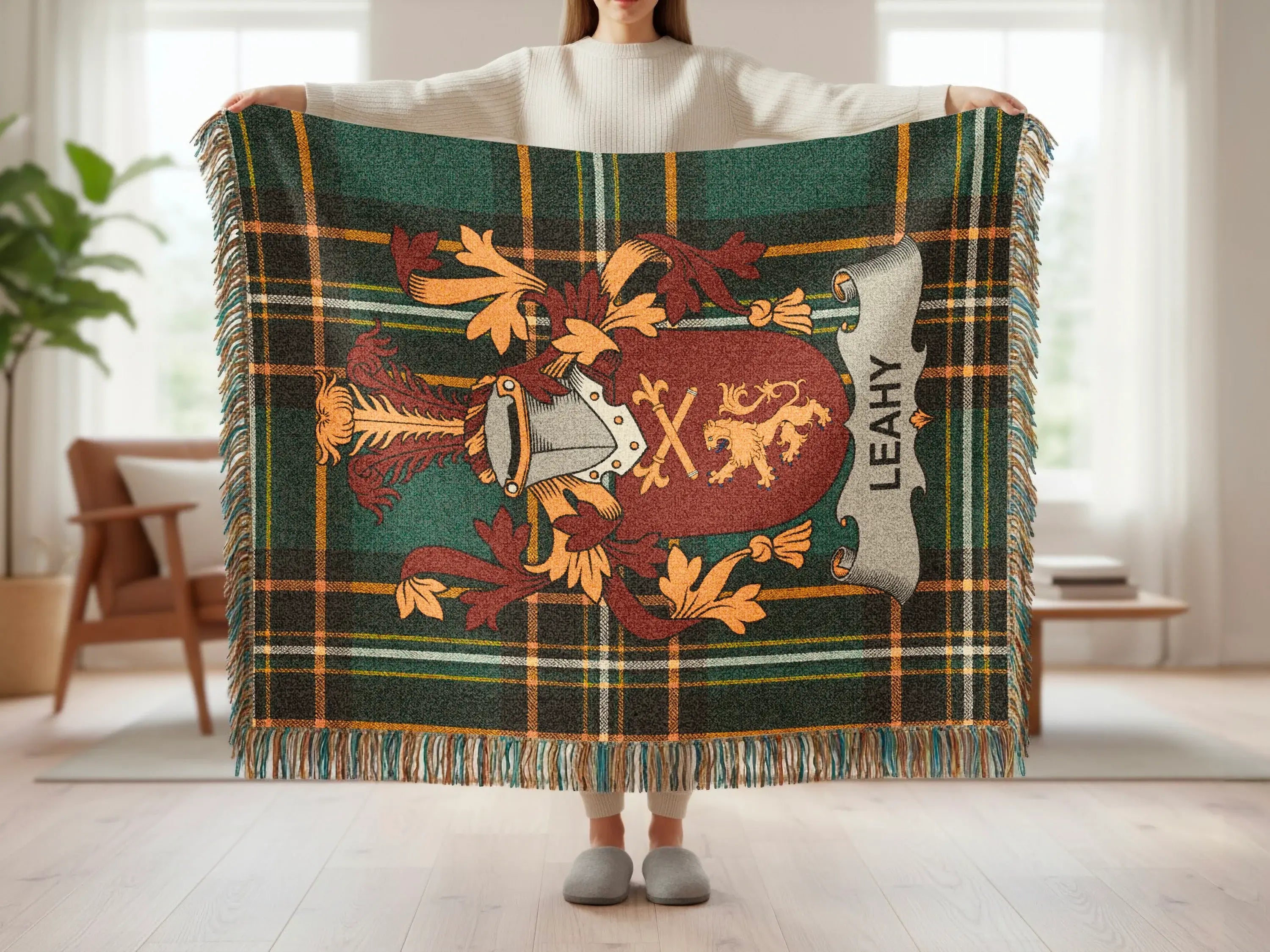 Leahy tartan throw blanket with heraldic crest and fringe.