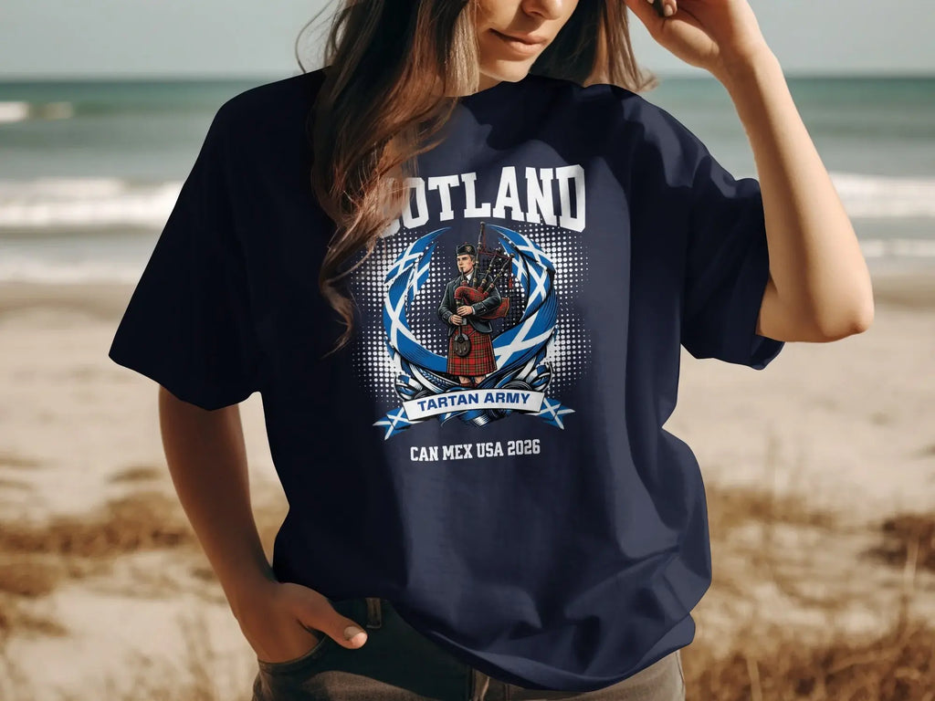 Navy t-shirt with "Scotland Tartan Army" and bagpiper graphic, "CAN MEX USA 2026" text.